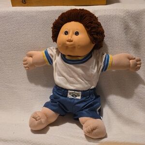Charming Doll with Curly Brown Hair